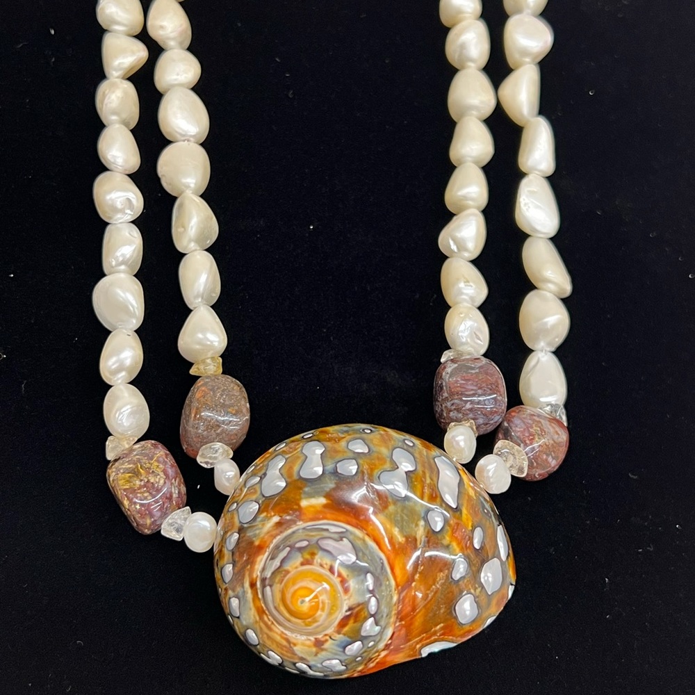 Meg Carter pearl and stone necklace with an African Turbo Seashell feature.